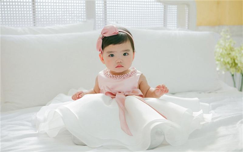robe bébé rose et blanche