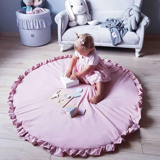 tapis rond rose chambre bebe